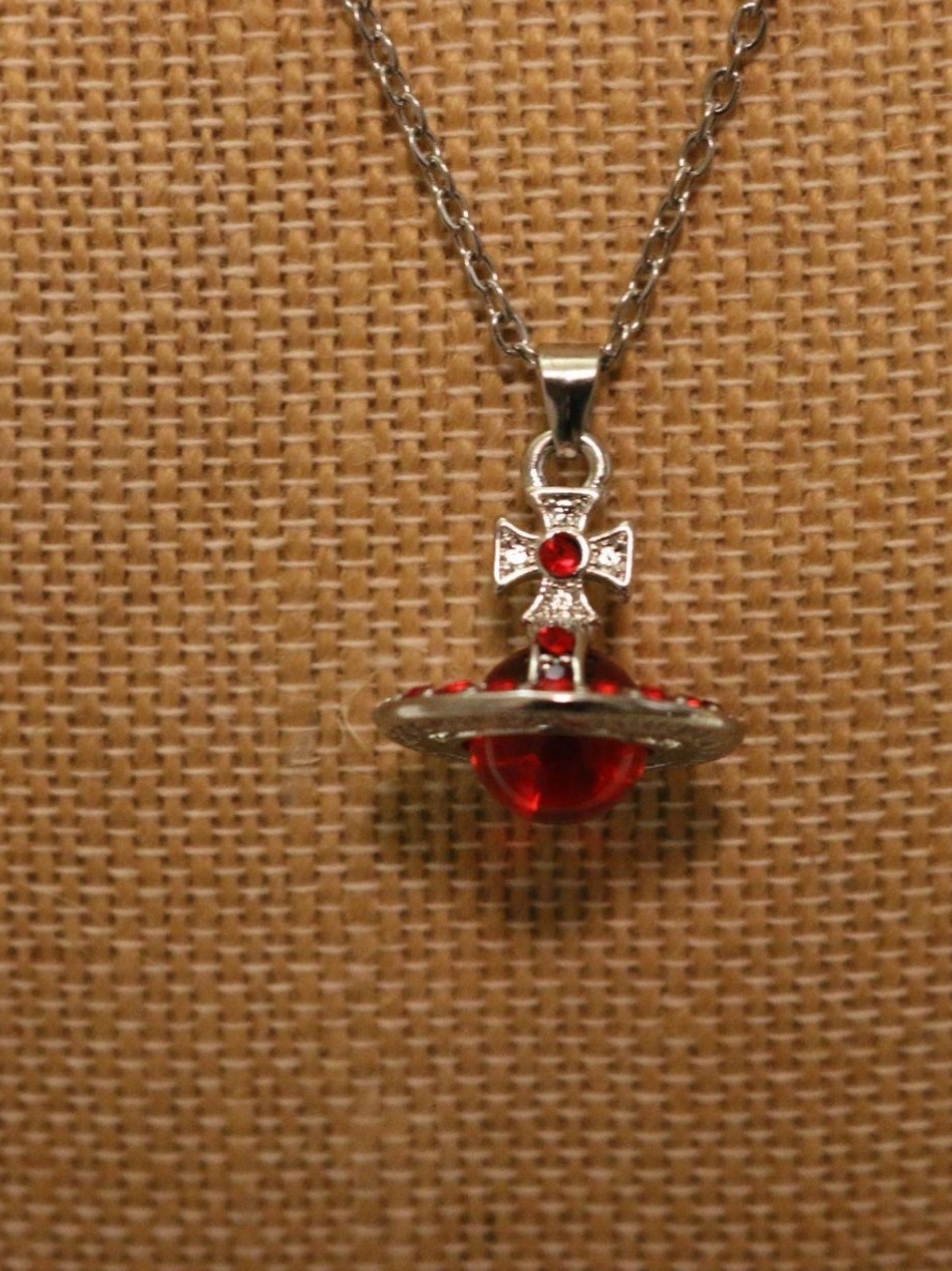 Viviene Westwood Silver Pendant Necklace with Red Orb Accent